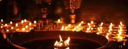 butter lamps with flames near bodhnath stupa in ka utc